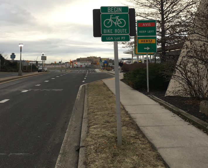 Bike route signage -- but no bike lane -- near the LaGuardia marine terminal.