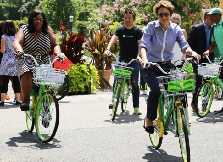 Here's Trottenberg (with Council Member Debi Rose at far left) on a Lime bike. Photo by DOT.