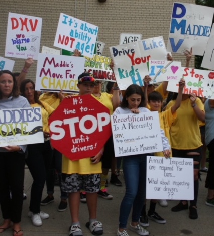 More than 200 people rallied in Whitestone on Monday night to demand that DMV conduct road tests for older drivers. The protest follows the death of Maddie Sershen after an 88-year-old driver ran a red light on Utopia Parkway. Photo by Rita Barravecchio