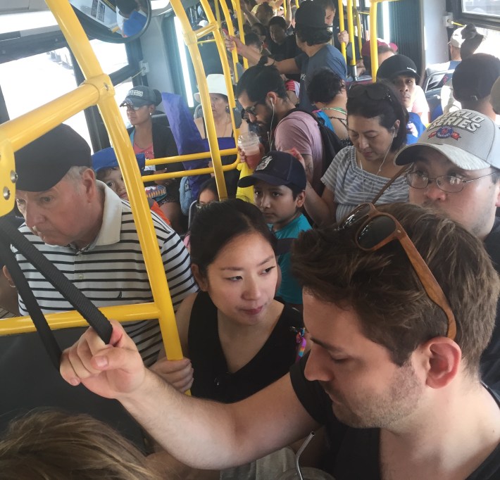 The Q53 leaves its second stop on Roosevelt Avenue, already packed with beachgoers. Photo: Angela Stach