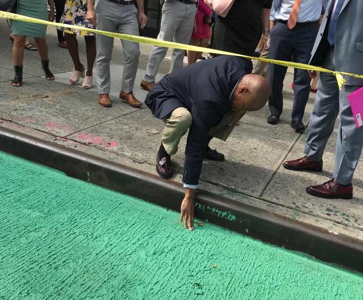 Yes, it's real and it's spectacular. Borough President Eric Adams touches the new green paint to make sure he's not dreaming.