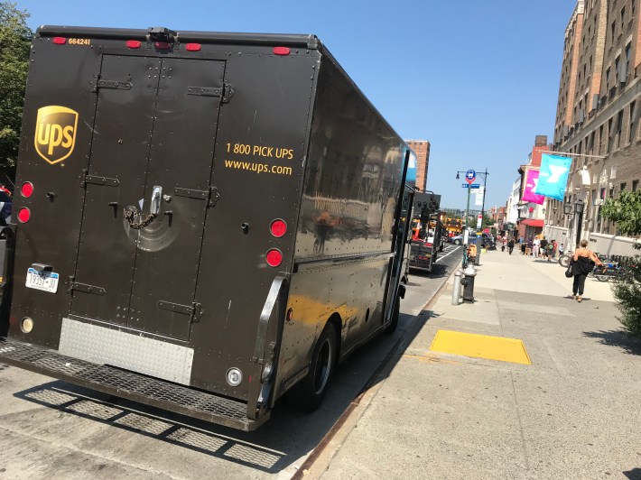 Of course, even with the city's press corps watching, and city officials championing their new bike lane, trucks were still illegally parked on Ninth Street, creating a safety hazard...and bad optics.