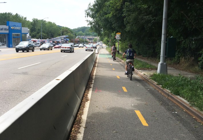 Eastern Queens cyclists are safer since the city installed a protected two-way bike lane near Joe Michaels Mile. Photo: Laura Shepard