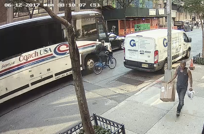 A video still shows the moment when bus driver Dave Lewis passed too closely to cyclist Dan Hanegby, who had the right of way, killing him.