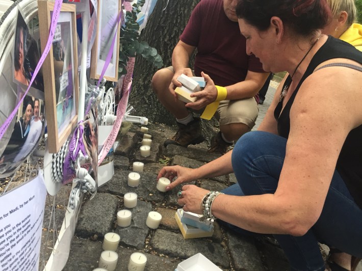 Lyden's friend Carolyn Bischof lit a candle at the dead woman's memorial.