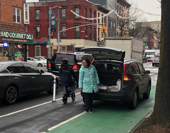 A bike lane that is not physically protected will often be blocked, as this one on Grand Street is. Photo: Philip Leff