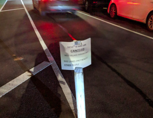 This sign suggested that West Village residents think the roads belong to them. Photo: Jonathan Warner