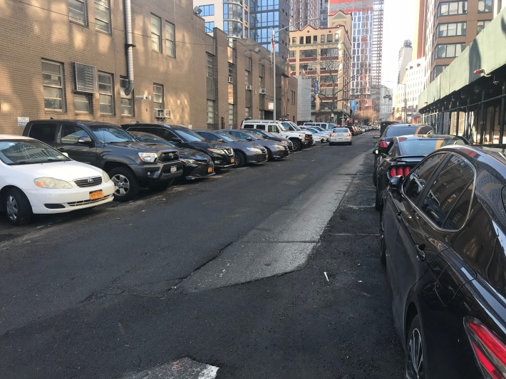 Most police station houses are ringed by legally and illegally parked private police officers' vehicles — many of which have been slapped with multiple tickets. Here's the scene at the 84th Precinct station house. Photo: Julianne Cuba