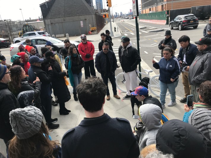 Michael Vega (left) and Gabriel Spencer, the victim's brother, honored the dead cyclist at the crash site on Saturday.