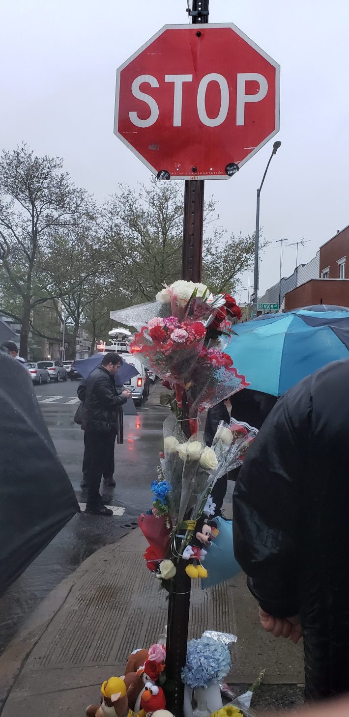 Flowers marked the rainy vigil for Emur Shavkator on Sunday. The 3-year-old was run over and killed on Thursday in Bensonhurst. Photo: Melodie Bryant