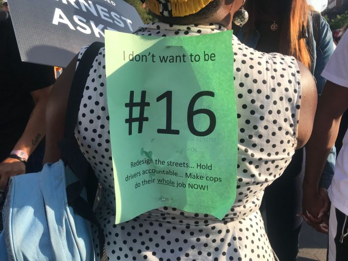 A protester at the "die-in" asks not to be the 16th cyclist killed by drivers this year.