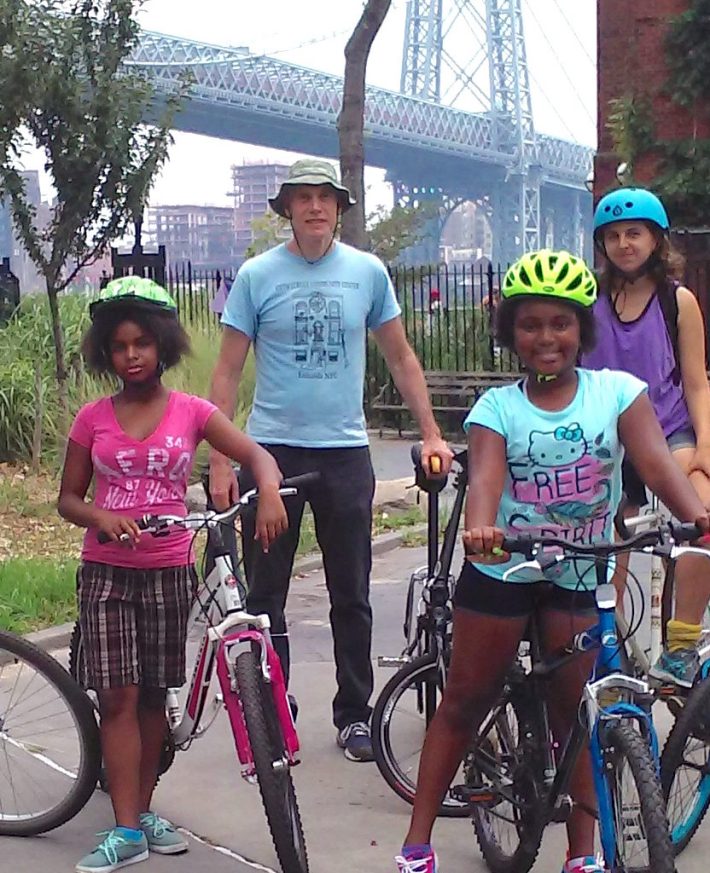 Howard Brandstein (standing) cycles with friends at East River Park.