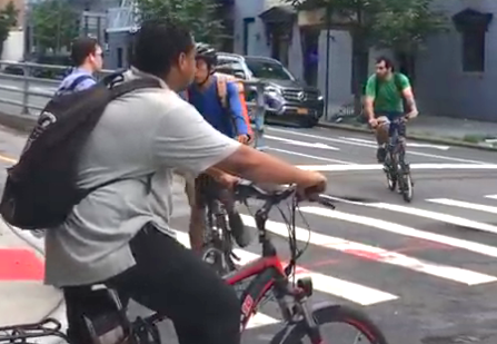 An everyday cyclist/pedestrian mashup getting on to the QBB shared path from Manhattan. Such conflicts have prompted calls for cyclists to have a dedicated lane. Photo: Steve Scofield