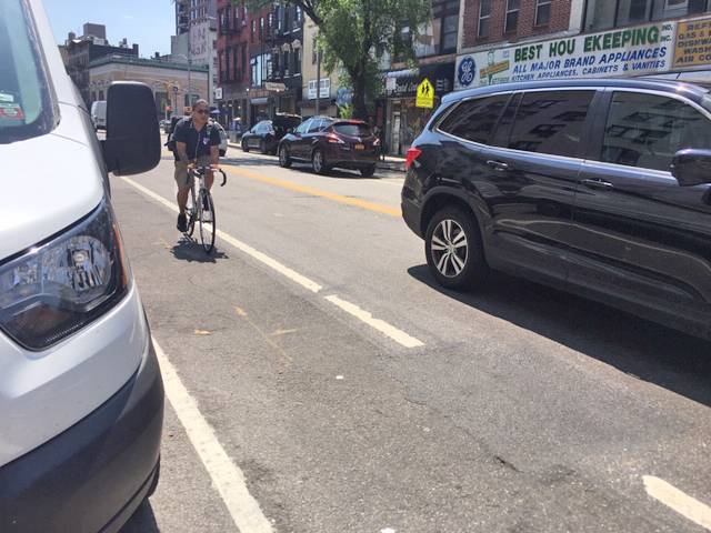 Another cyclist relies on city paint — and his own prayers. Photo: Vivian Lipson