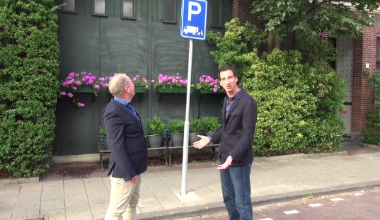 Mark Gorton (left) and Amsterdam Alderman Rocco Piers survey the coolest-ever loading zone, in Amsterdam's Frans Haalsburt neighborhood.
