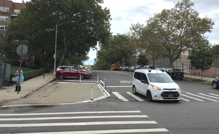 DOT daylighted the corner of W. 237th Street and Hudson Manor Terrace with bollards. Car owners want them removed. Photo: Eve Kessler