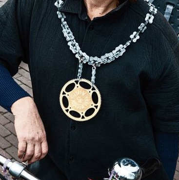 In Amsterdam, the bike mayor wears a ceremonial crest (which is really just a piece of a gear).