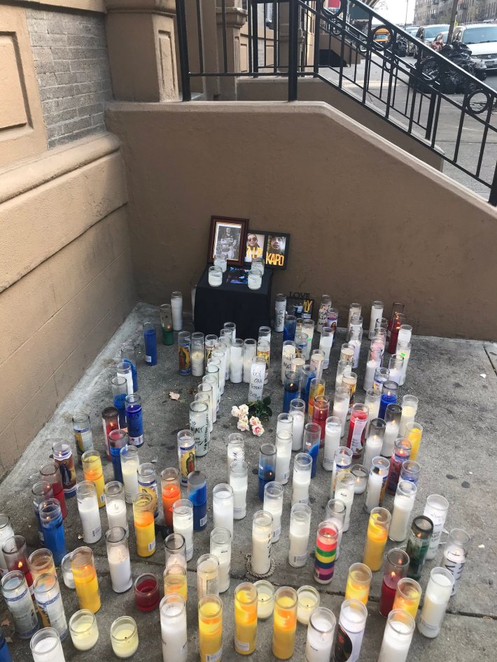 Candles outside Matt Travis's Bronx apartment on Monday. Photo: Julianne Cuba