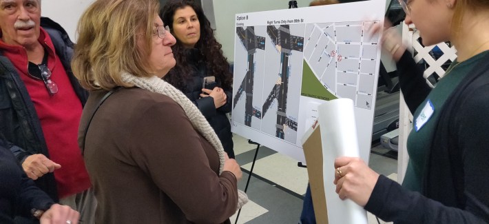 A resident inspects a DOT poster at the CB 10 Traffic and Transportation Committee workshop January 14. Photo: Toby Hyde