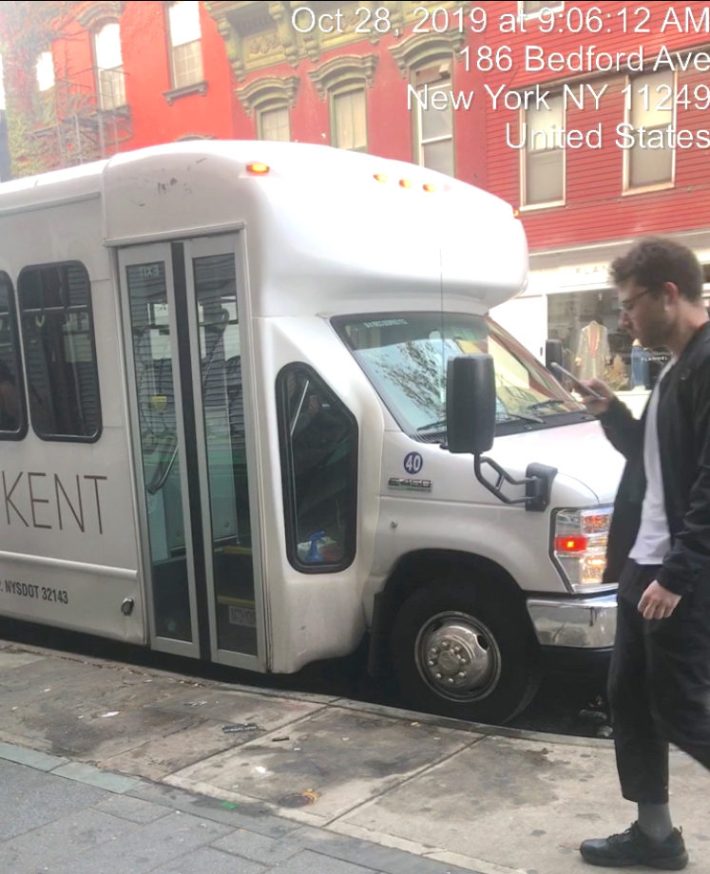 A shuttle bus caught idling on Bedford Avenue. Photo: Lael Goodman