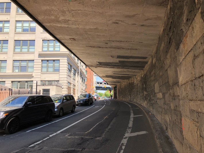 York Street partially covered by the BQE. Apartments with triple-paned sound proof windows that you can never open are to the left. Photo: Michael King