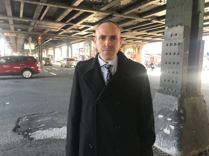 Council Member Mark Treyger standing at the corner of 86th Street and Bay Parkway, where he says he regularly sees massive trucks speeding and going through red lights. Photo: Julianne Cuba