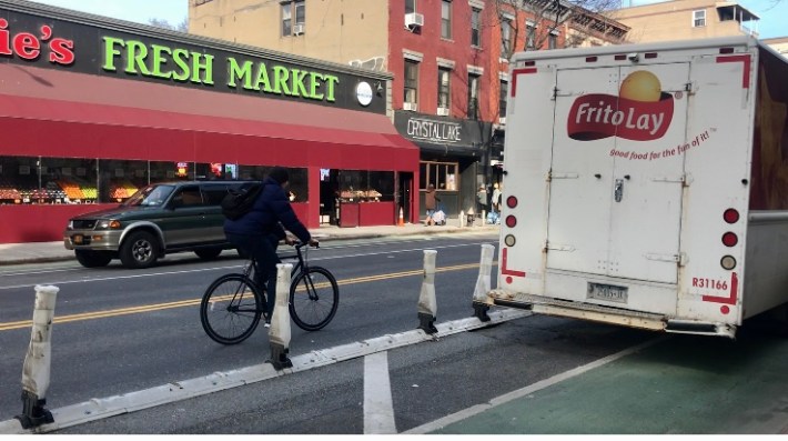 A cyclist leaves the bike lane to
