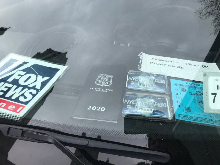 A Fox News car with a PBA business card and notebook in its dash. Photo: Julianne Cuba