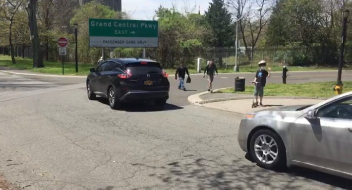 kid waiting for cars