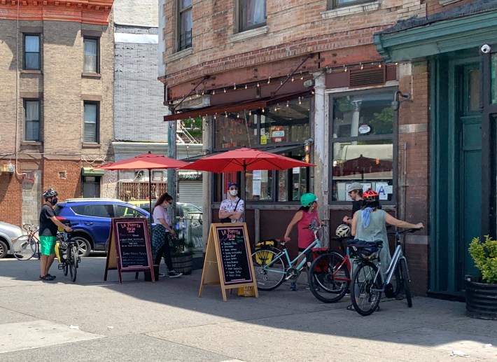 This is a typical scene outside of a restaurant — this one was in Park Slope — that will continue if the mayor does not create more open space. Photo: Gersh Kuntzman