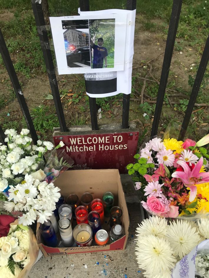 Candles mark the spot where Ivan Morales was killed. Photo: Steven Vago