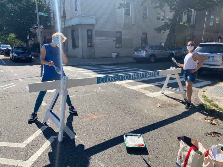 Volunteers beautify open street barricades on Driggs Avenue and Sutton Street. Photo: North Brooklyn Open Streets Community Coalition