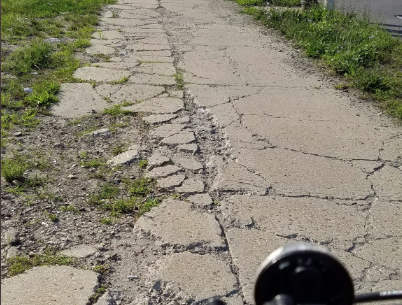 A typical pitted stretch of the bike path. Photo: Brian Hedden
