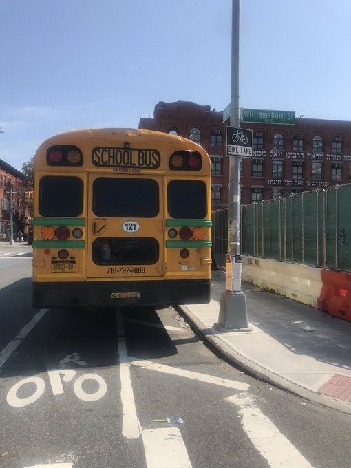 A school bus parked in the bike lane on Wythe Avenue a day after Sarah Pitts was killed here. Photo: Julianne Cuba