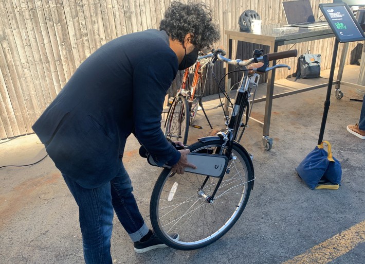 Somnath Ray shows off his bike attachment called The Clip. Photo: Gersh Kuntzman