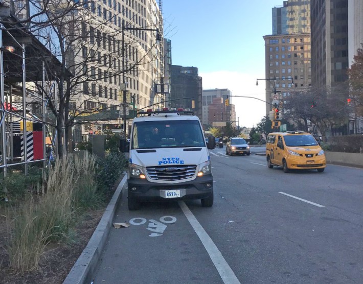 Cops parked in the bike lane on Adams Street. Photo: Julianne Cuba