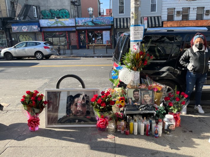 Candles and flowers mark the spot in Williamsburg where Adrian Santos was killed. Photo: Elizabeth Orth