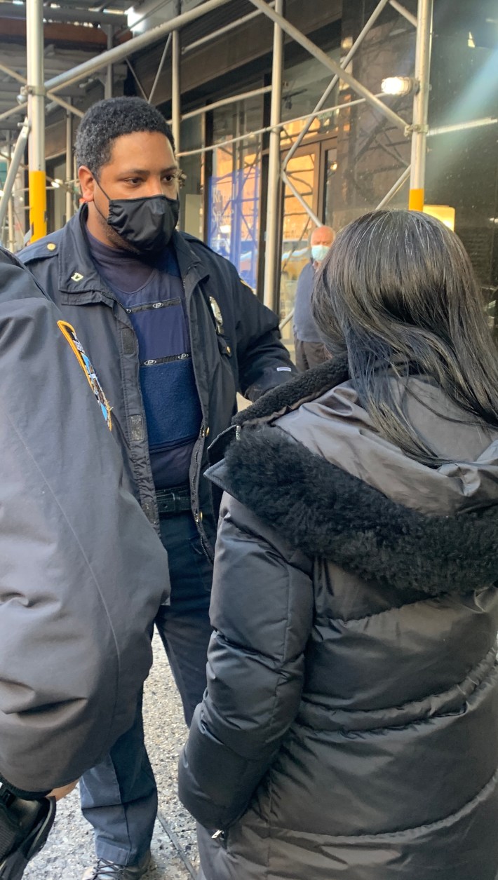 Officer McCloud talking to the driver.