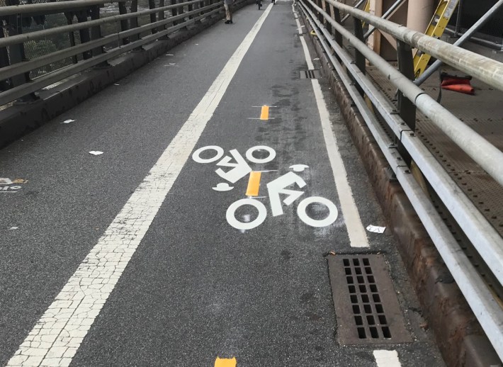 Even the stencils on the Queensboro Bridge are crashing into each other.