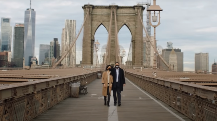 Andrew Yang and his wife Evelyn Yang walk across the Brooklyn Bridge in a campaign video. Photo: Yang Campaign