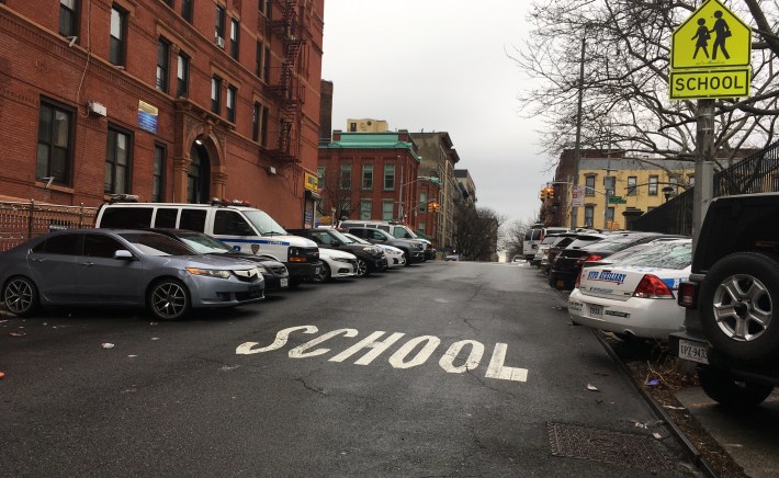 A school crossing on W. 151st St. blocked on both sides by police cars. Photo: Eve Kessler