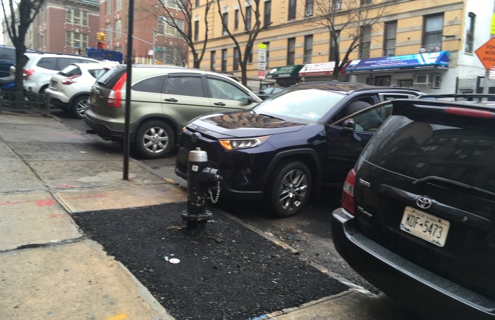 Fire hydrant equals parking space for the 34th Precinct, safety be damned! Photo: Eve Kessler