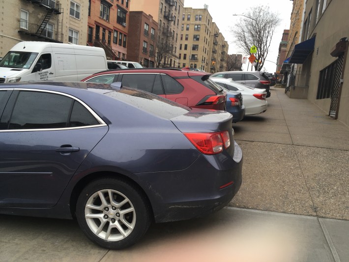 The sidewalk on the south side of 183rd Street, similarly car choked. Photo: Eve Kessler