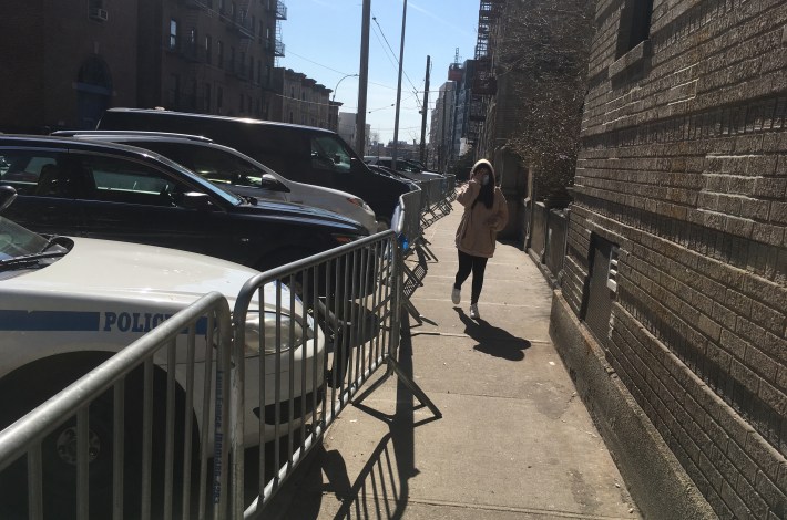 Could a wheel chair pass through the sidewalk space that the 46th Precinct allots for pedestrians on the west side of Ryer Avenue? Kind of dicey, we'd say. Photo: Eve Kessler