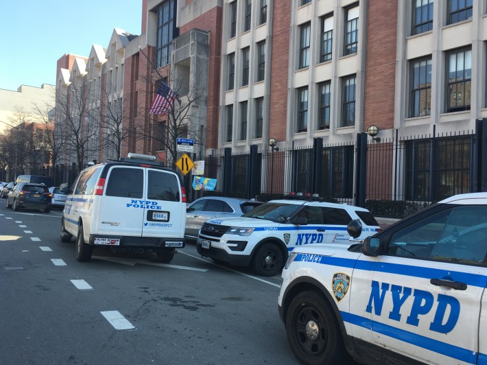 Cops just double-park wherever in near the 52nd Precinct station house. Photo: Eve Kessler