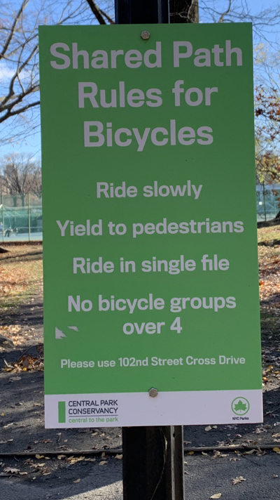 Signs like these are all over Central Park, indicating that cyclists and pedestrians must share a narrow path. File photo: Gersh Kuntzman