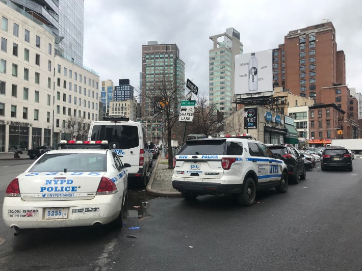 Squad cars from the nearby NYPD Transit Bureau District 2 park illegally on West Broadway. Photo: Julianne Cuba