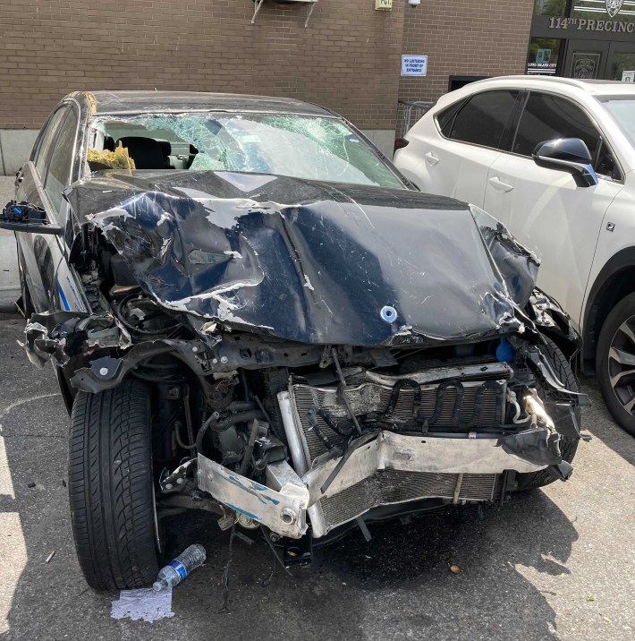 The wreckage of the car that killed Xing Long Lin back in April in Astoria. Photo: Julianne Cuba