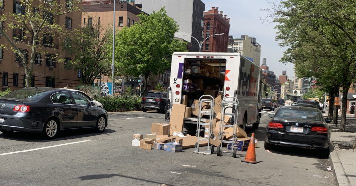 Imagine if this truck driver was given space to leave his packages in a mini-distribution center, where they would be picked up by another worker on a cargo bike. File photo: Gersh Kuntzman