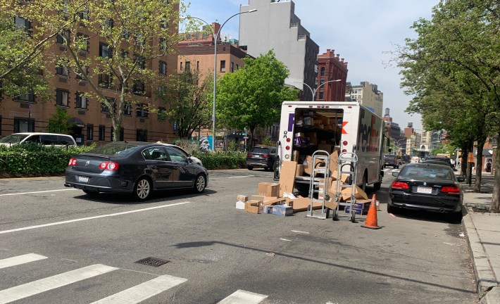 Imagine if this truck driver was given space to leave his packages in a mini-distribution center, where they would be picked up by another worker on a cargo bike. File photo: Gersh Kuntzman